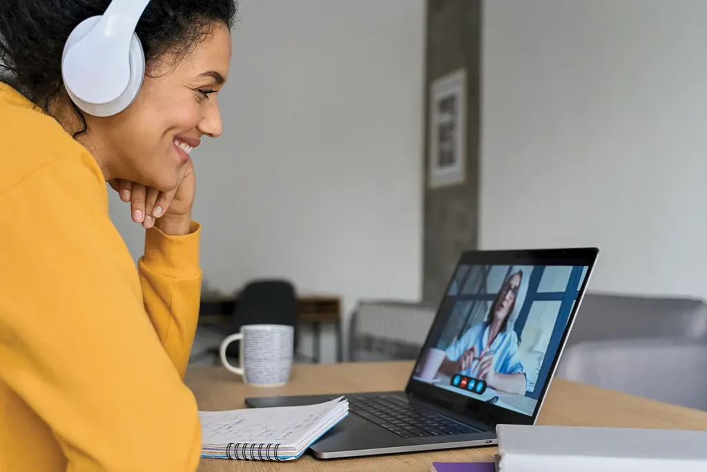 Woman having a virtual meeting on a laptop